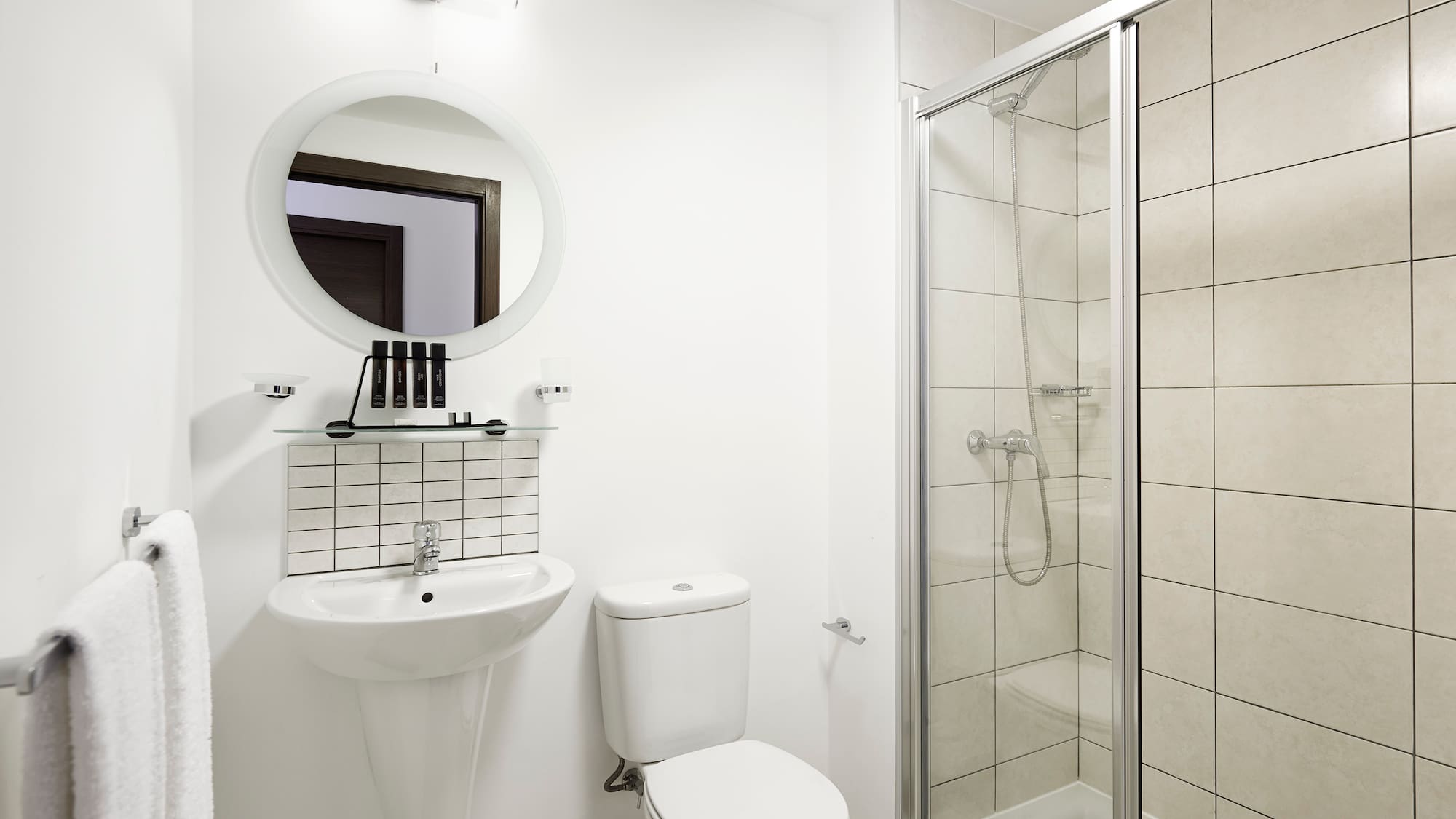 a bathroom with a shower and toilet