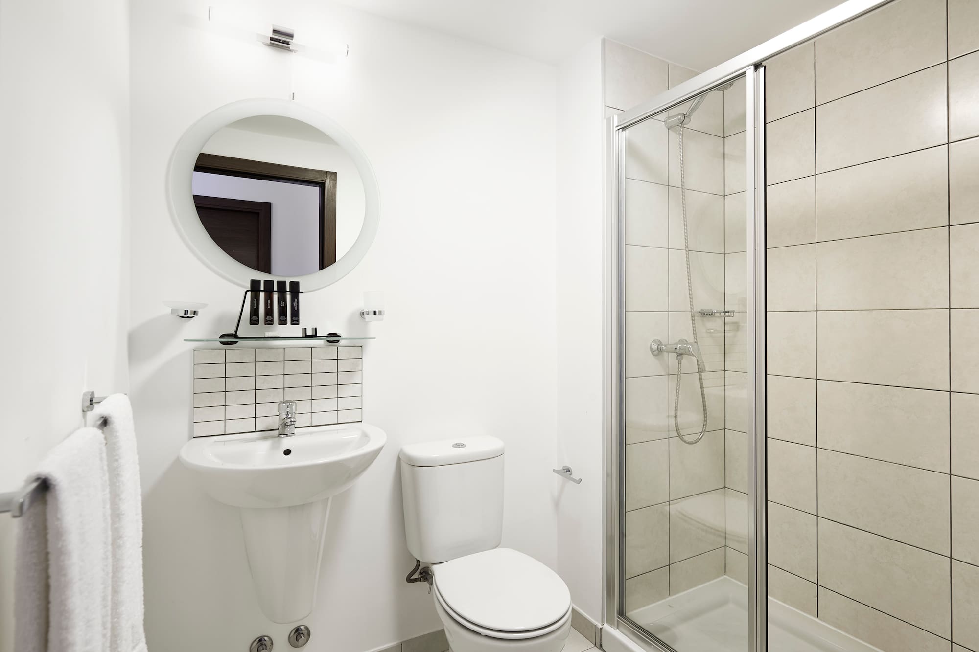 a bathroom with a shower and toilet