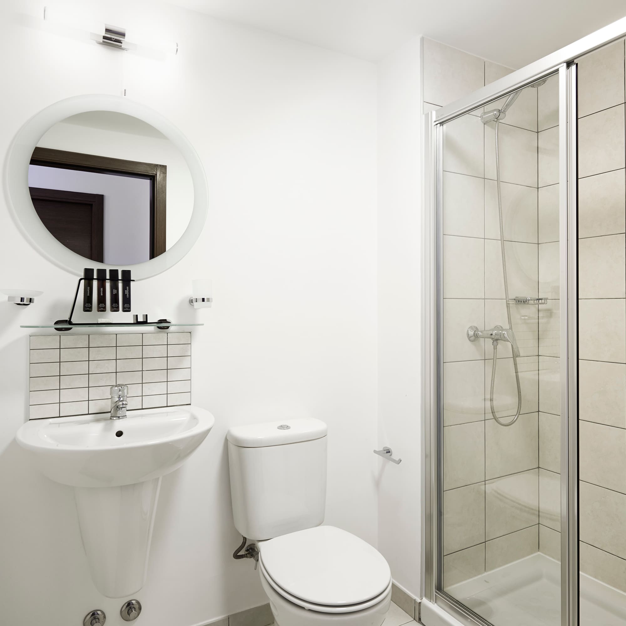 a bathroom with a shower and toilet