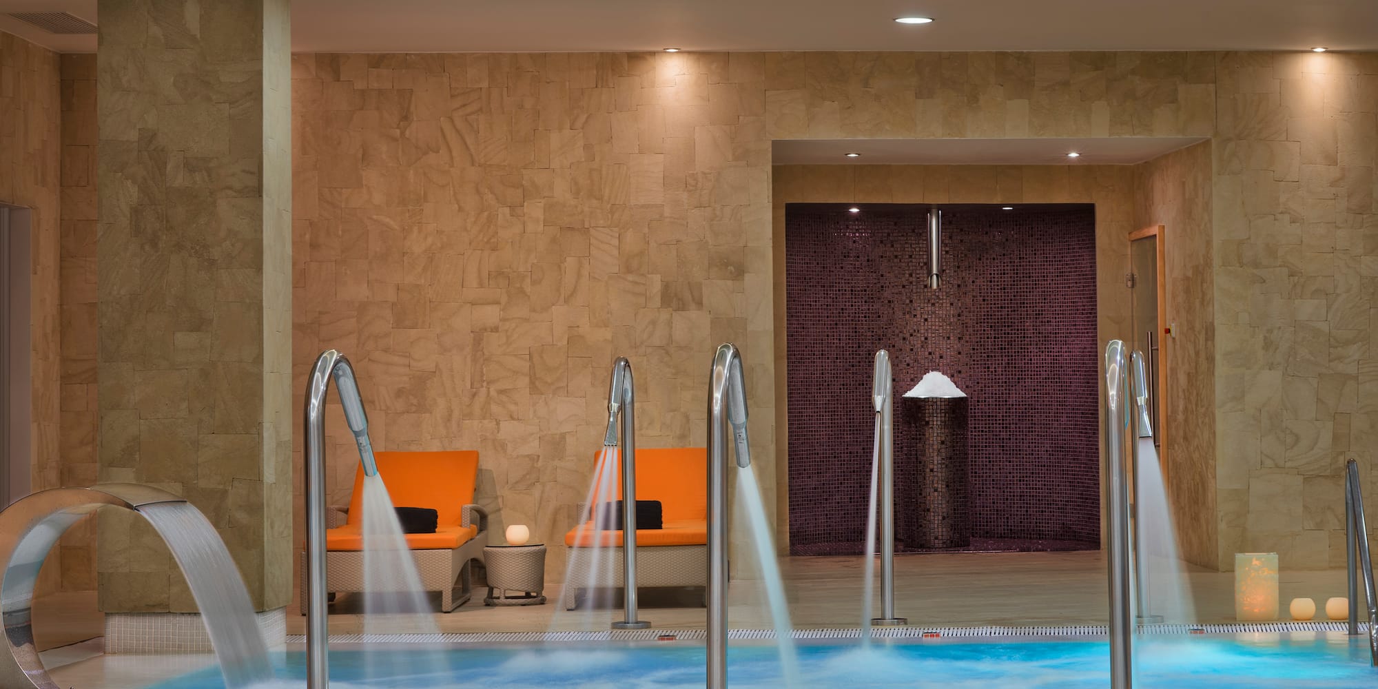 a pool with water running down the water