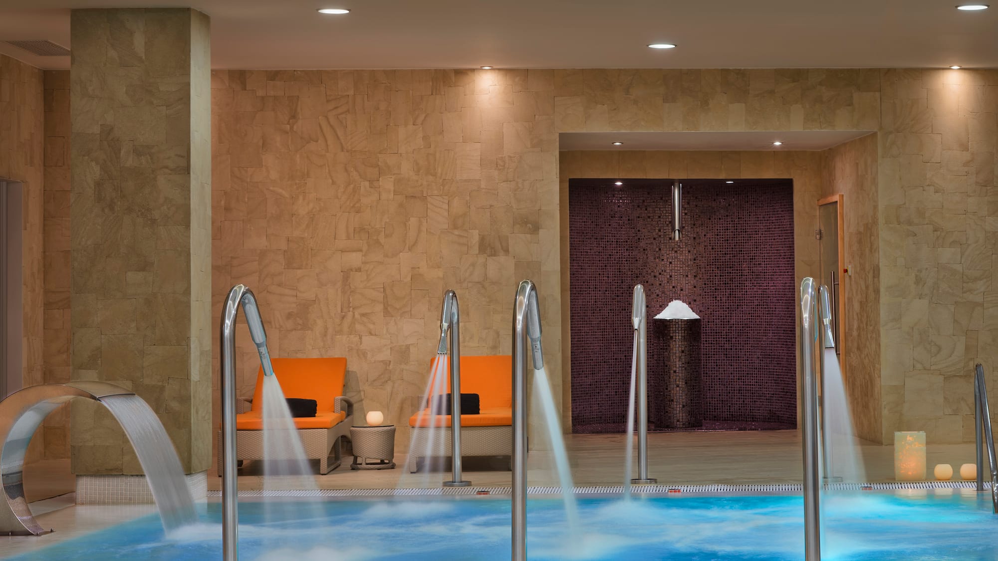 a pool with water running down the water