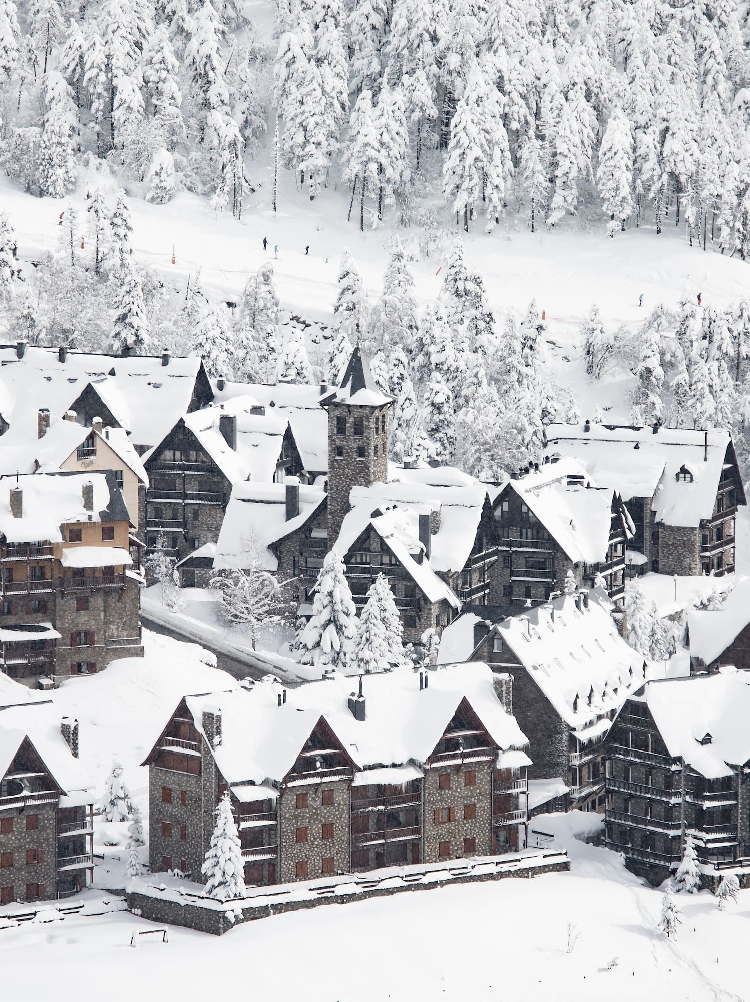 a group of houses covered in snow