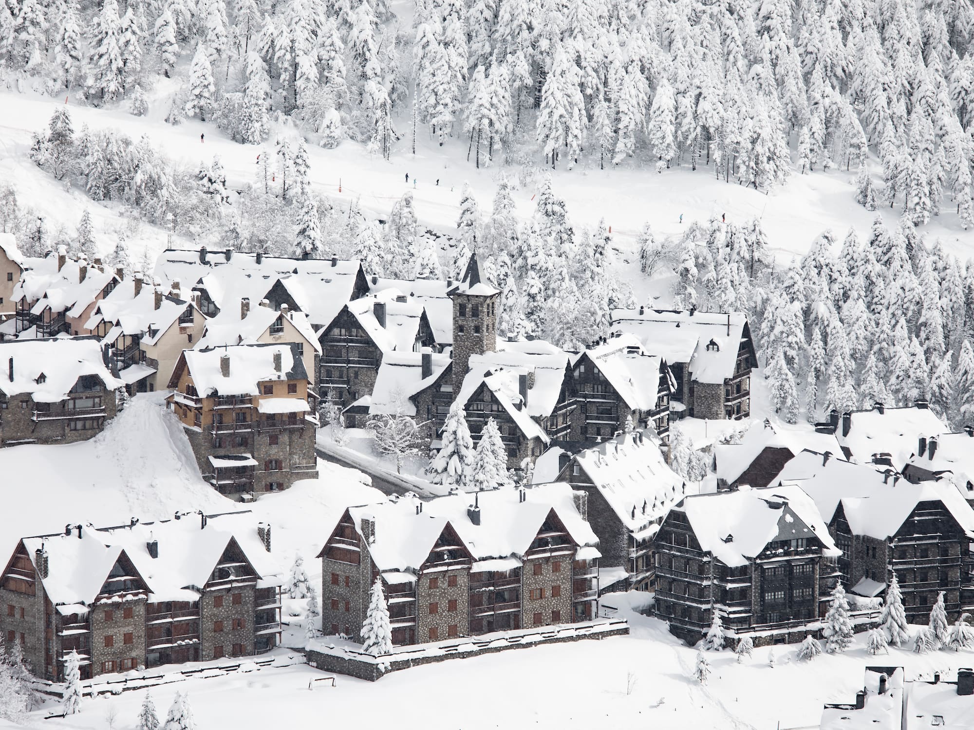 a group of houses covered in snow