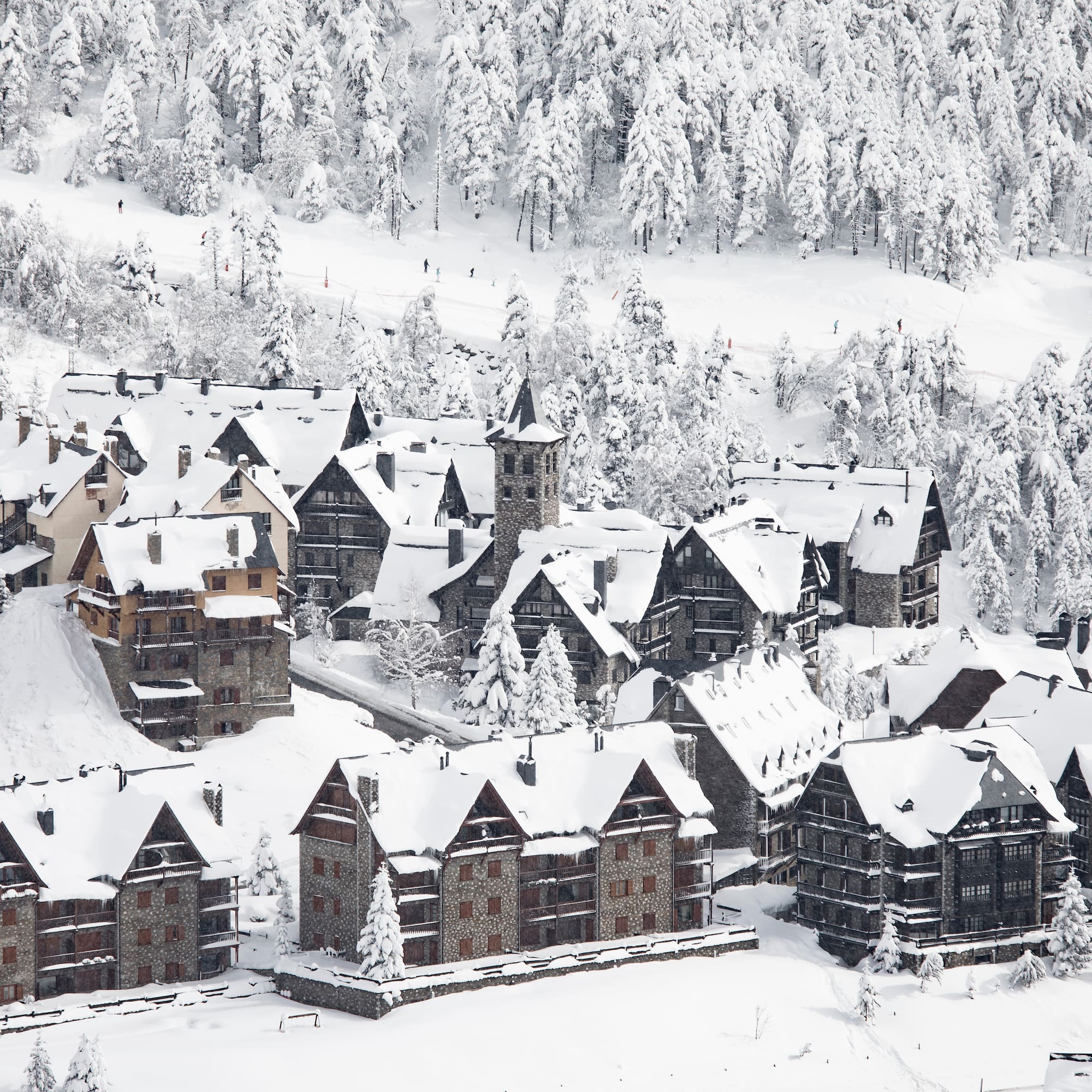 a group of houses covered in snow