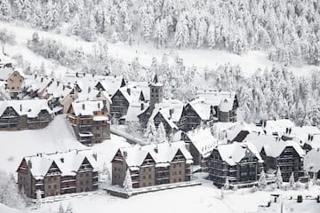 a group of houses covered in snow
