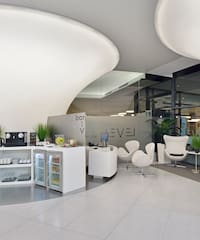 a room with white chairs and a white counter