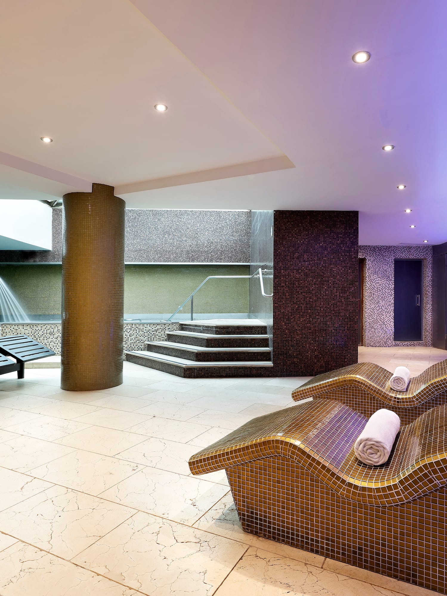 a room with chairs and a shower