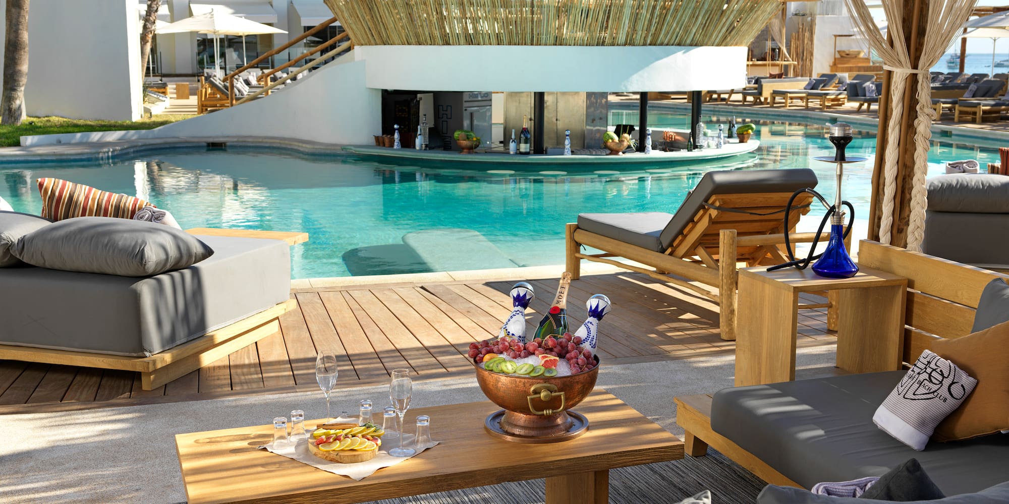 a pool with a table and chairs