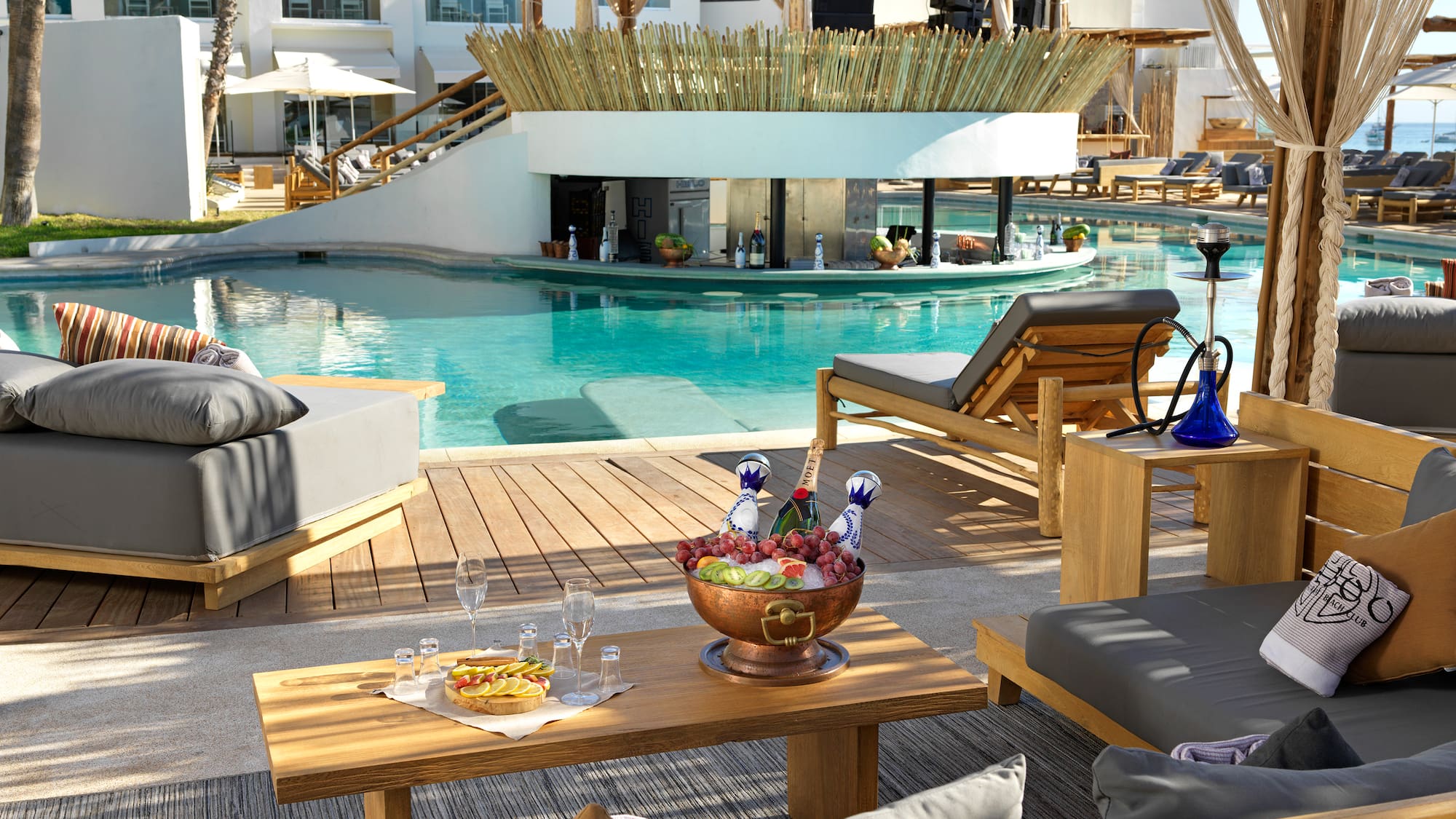 a pool with a table and chairs