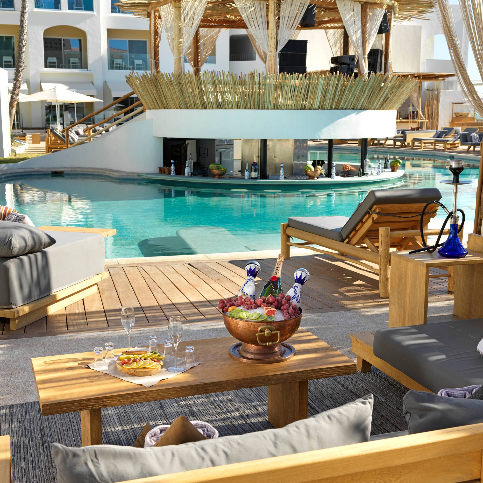 a pool with a table and chairs