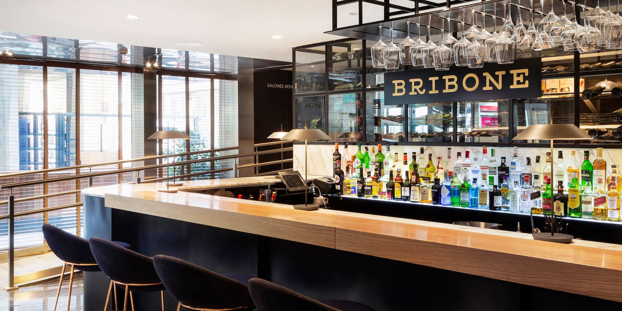 a bar with many bottles of alcohol