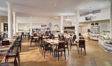 a restaurant with tables and chairs