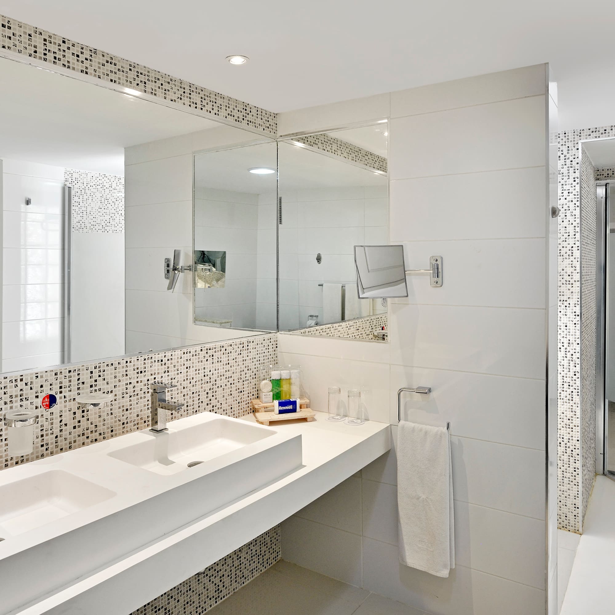 a bathroom with a mirror and sink