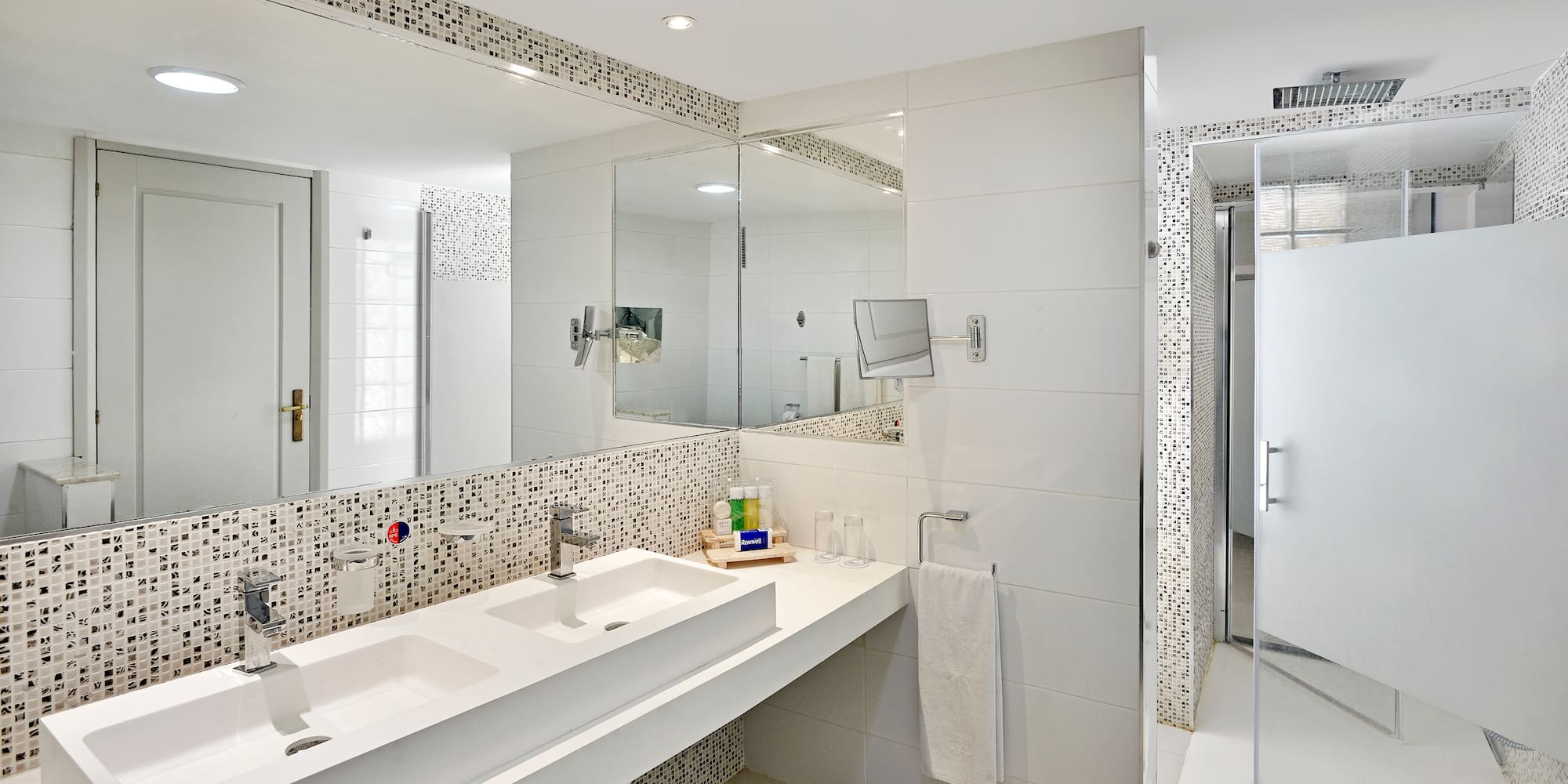 a bathroom with a mirror and sink