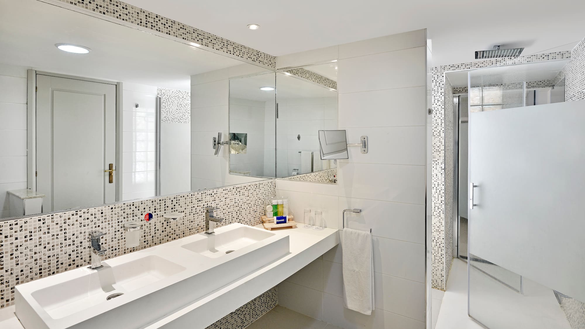 a bathroom with a mirror and sink