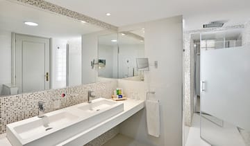 a bathroom with a mirror and sink