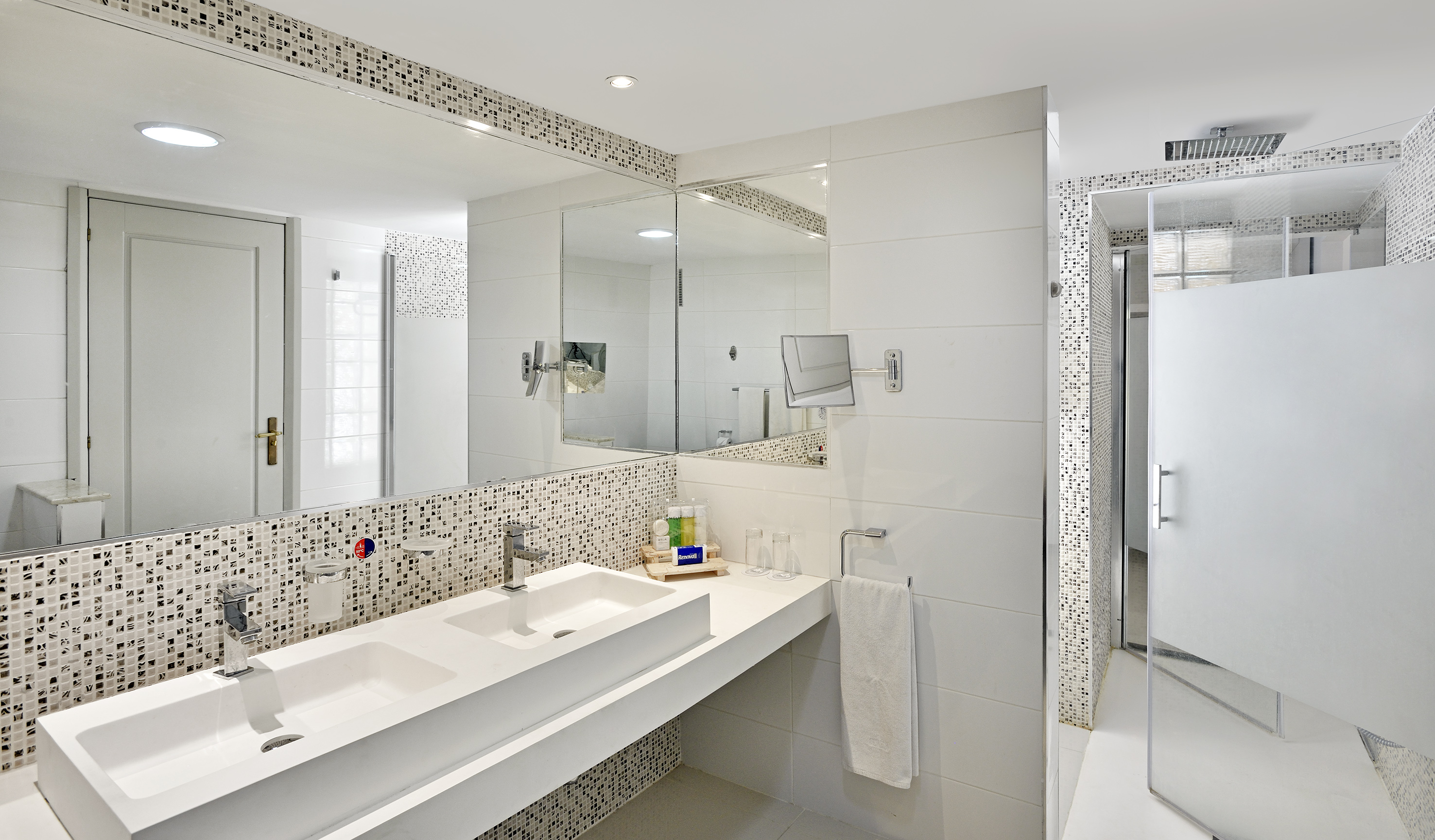 a bathroom with a mirror and sink