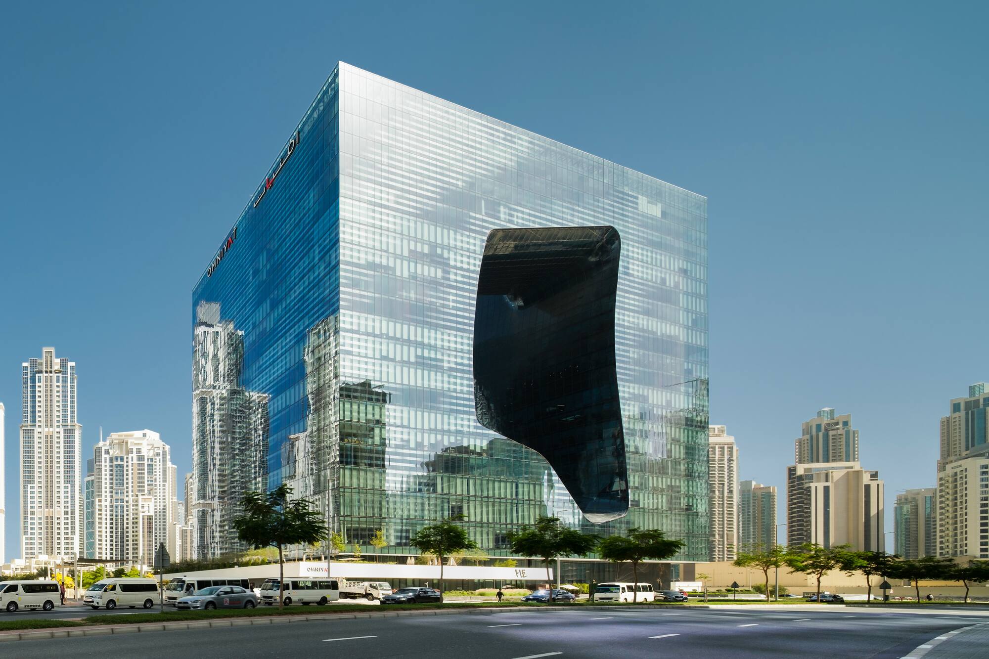 The Opus by Zaha Hadid: glass skyscraper with unique curved void in Dubai.