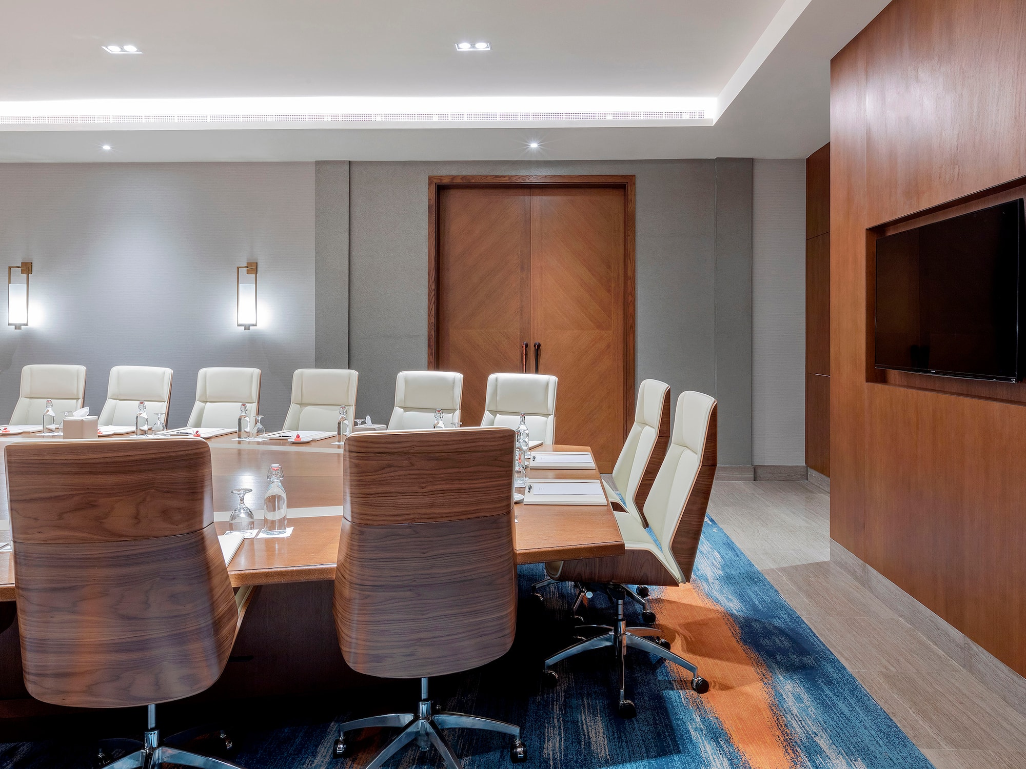 a conference room with a table and chairs