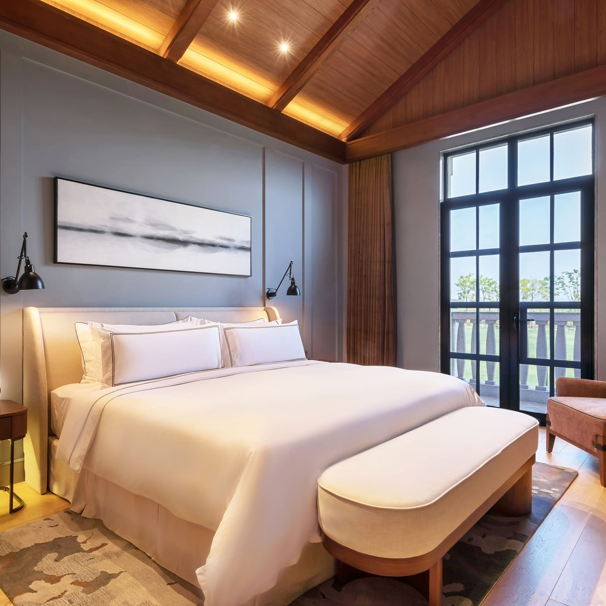 a bedroom with a bed and a chair