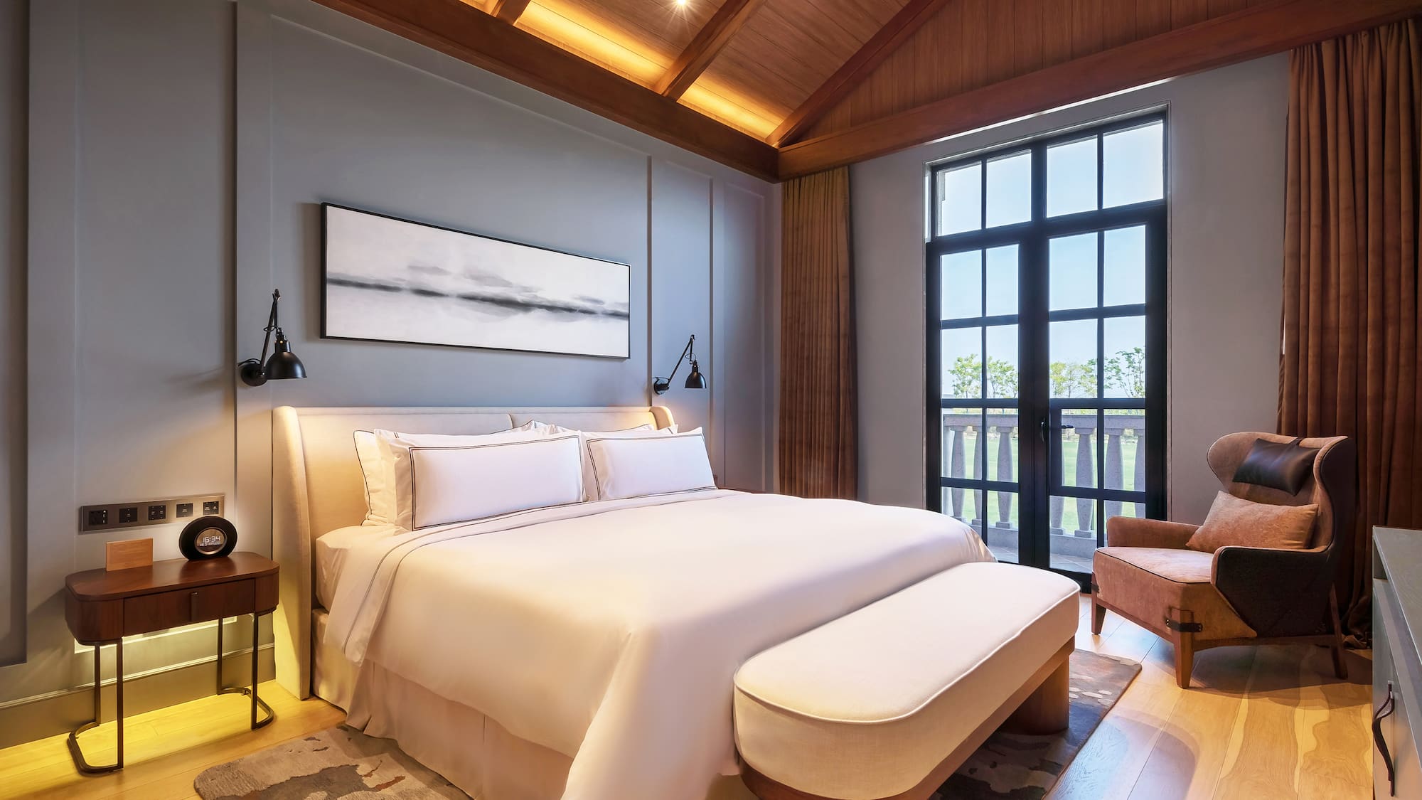 a bedroom with a bed and a chair