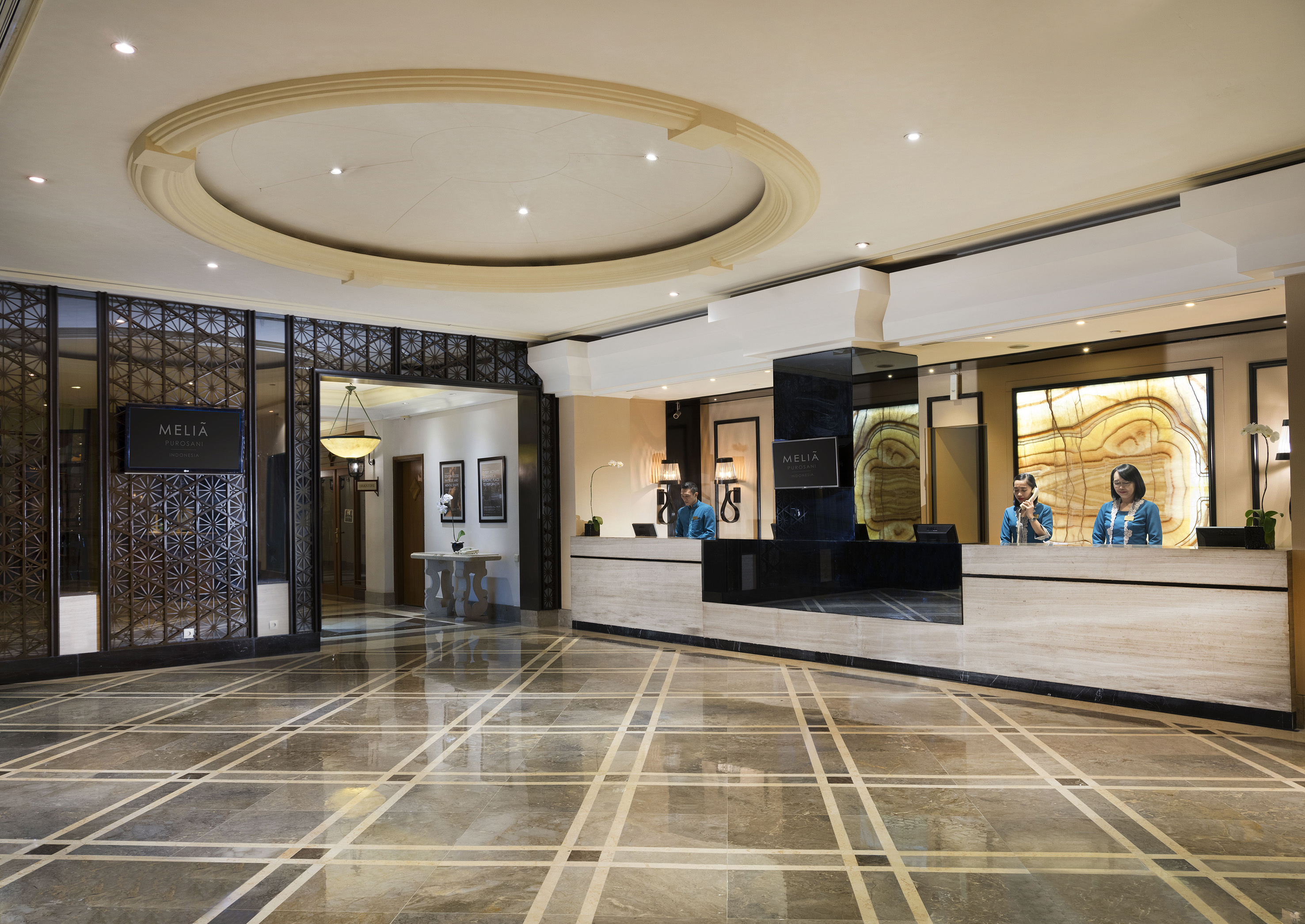 a lobby with a marble floor and a marble floor