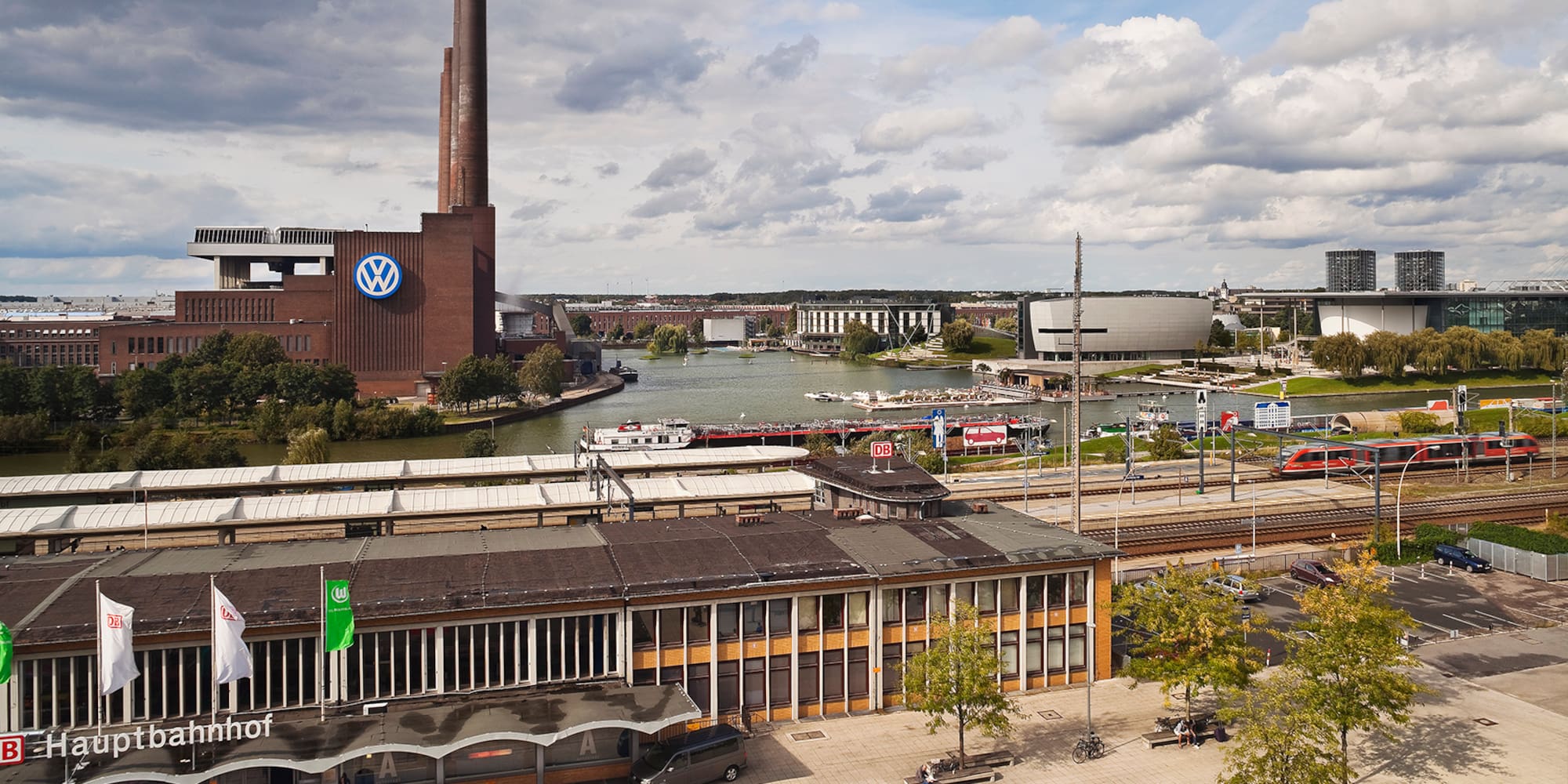 a city with a river and a factory