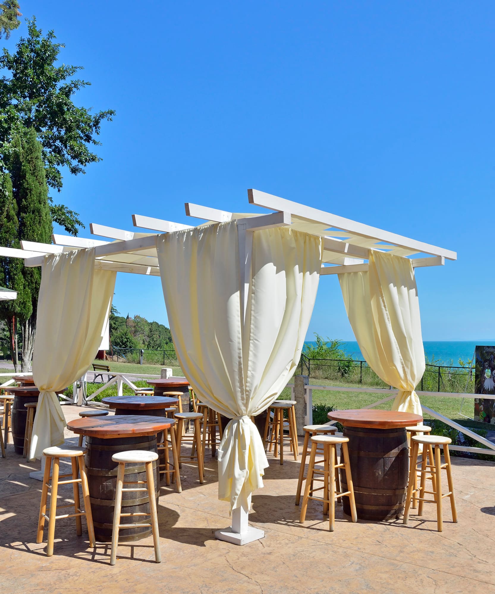 a patio with tables and chairs