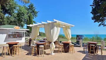 a patio with tables and chairs