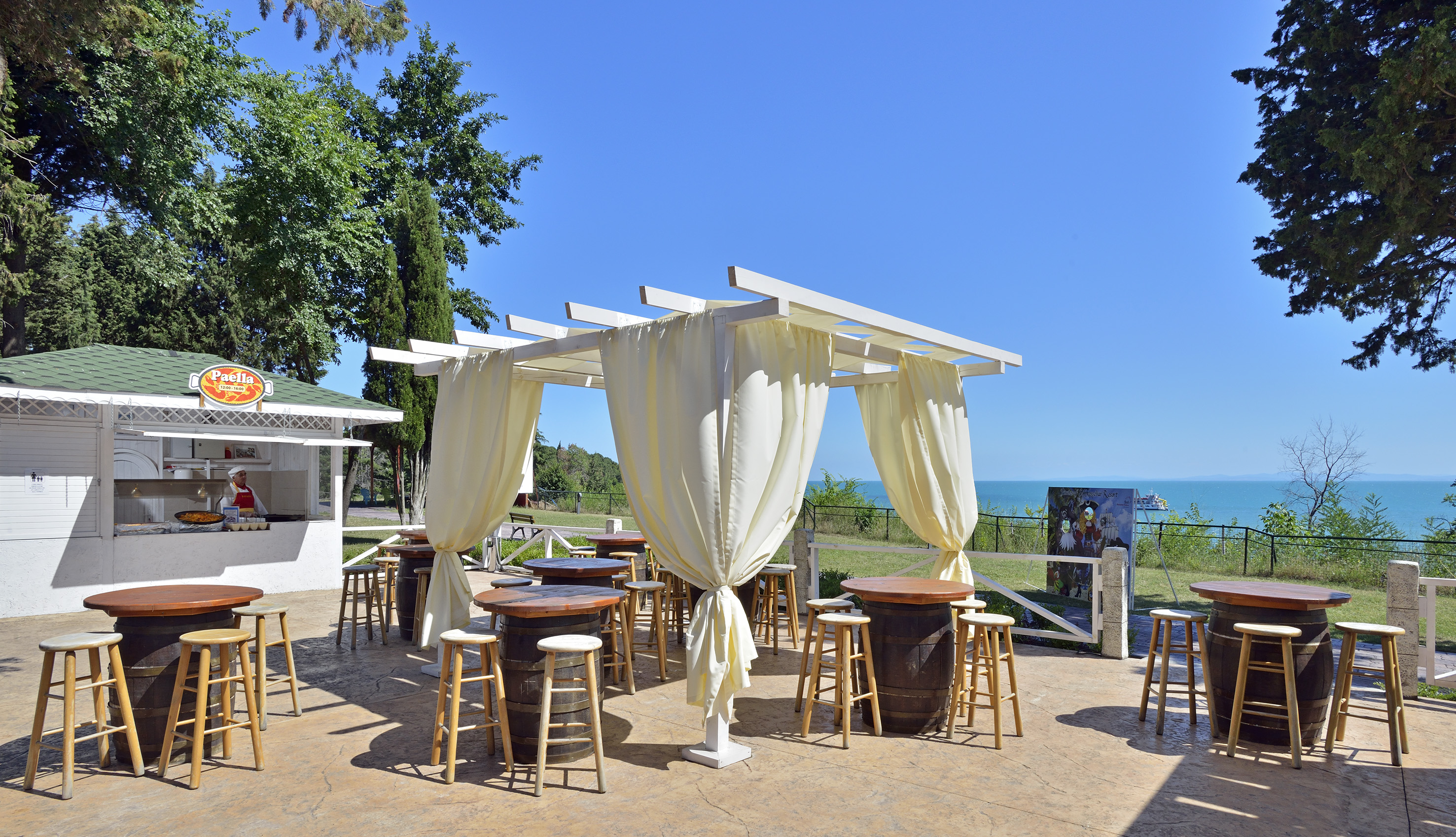 a patio with tables and chairs