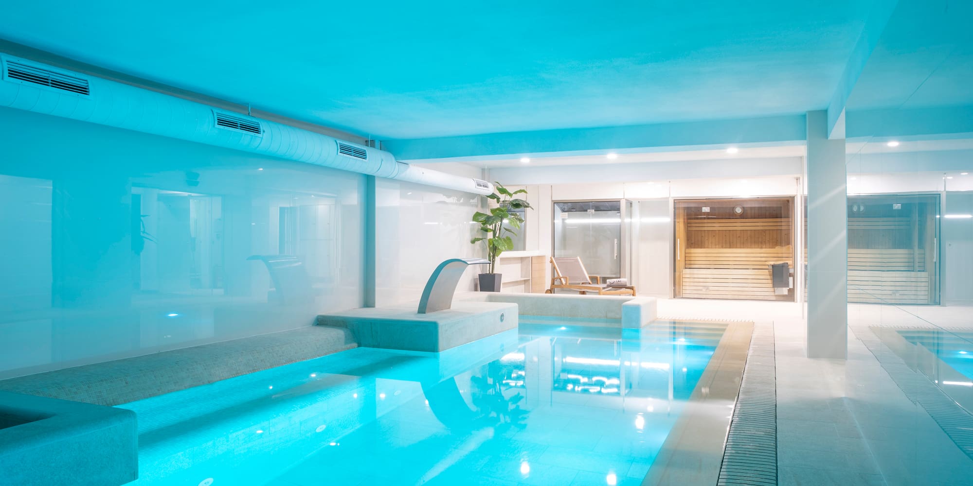 a indoor pool with a blue light
