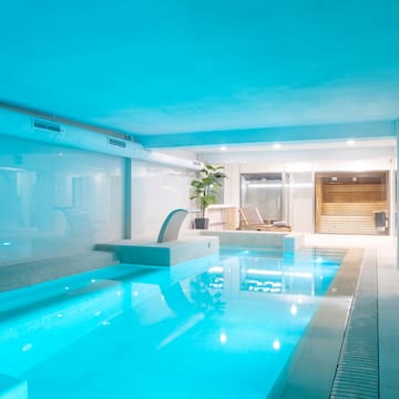 a indoor pool with a blue light