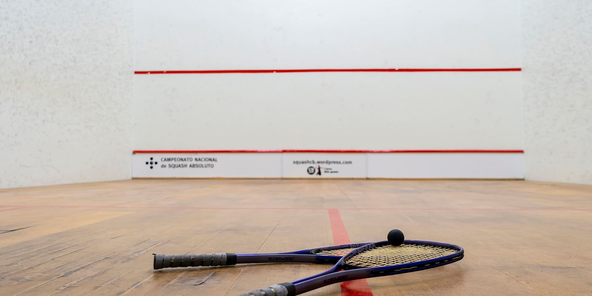a racket on a wooden floor