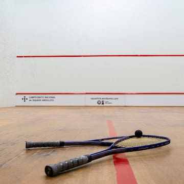 a racket on a wooden floor