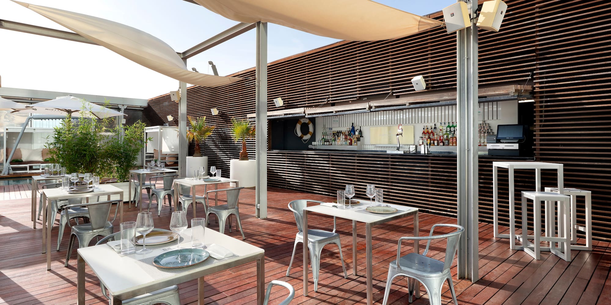 a patio with tables and chairs