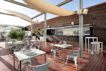 a patio with tables and chairs