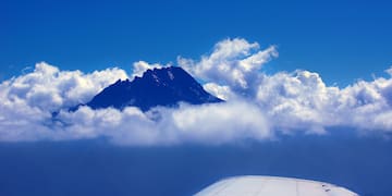 a mountain above clouds
