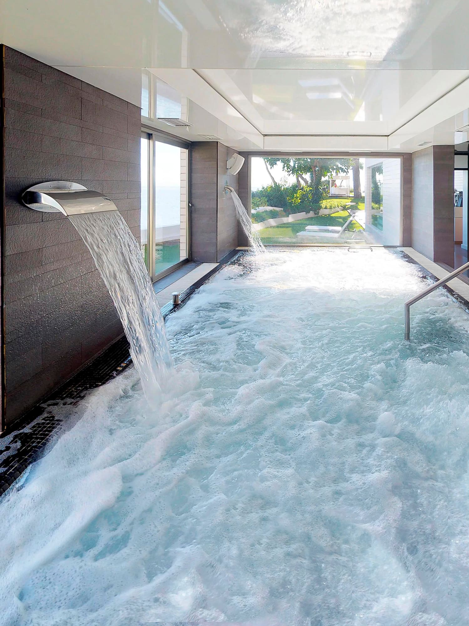 a hot tub with water falling out of it