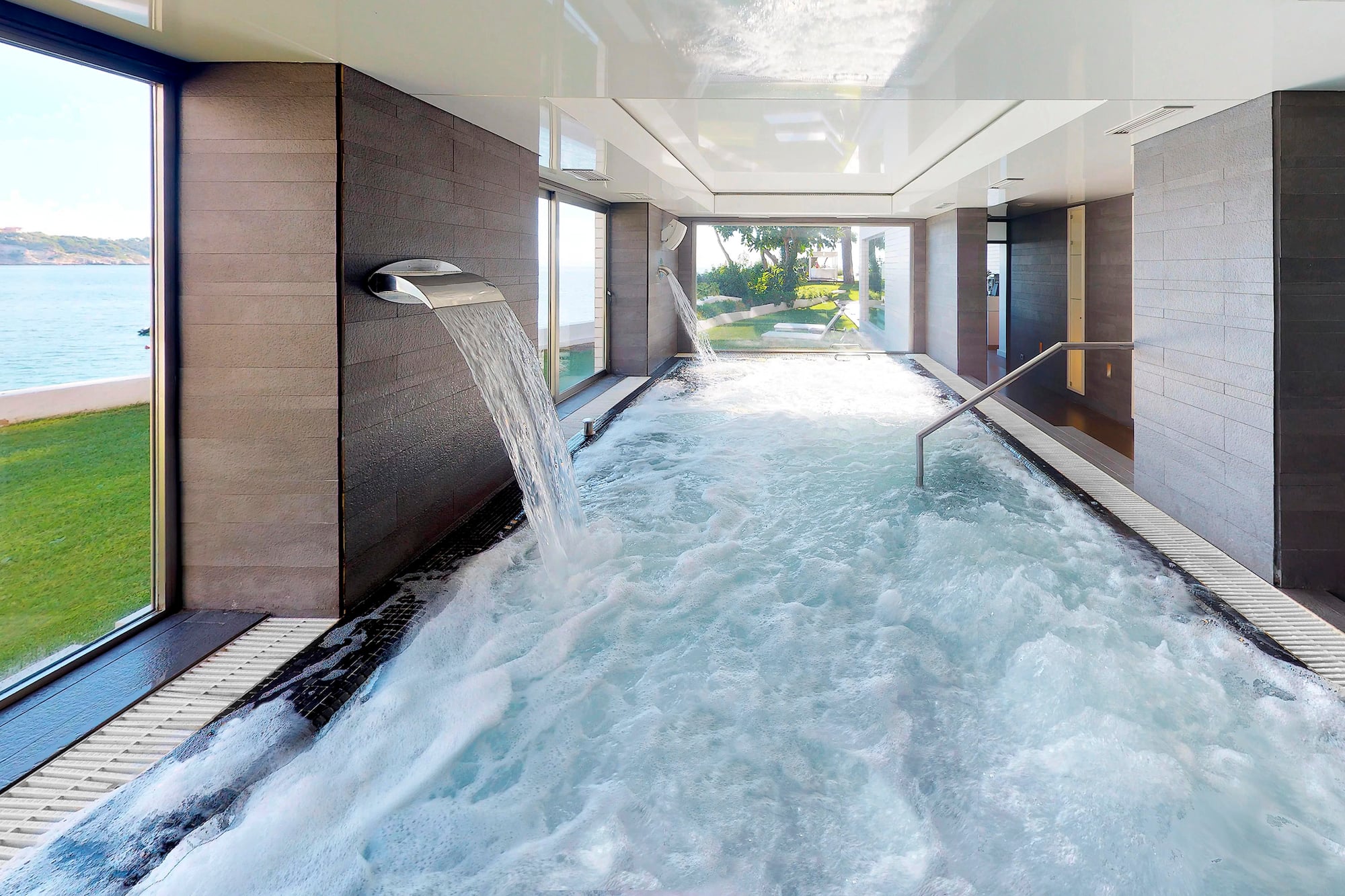 a hot tub with water falling out of it