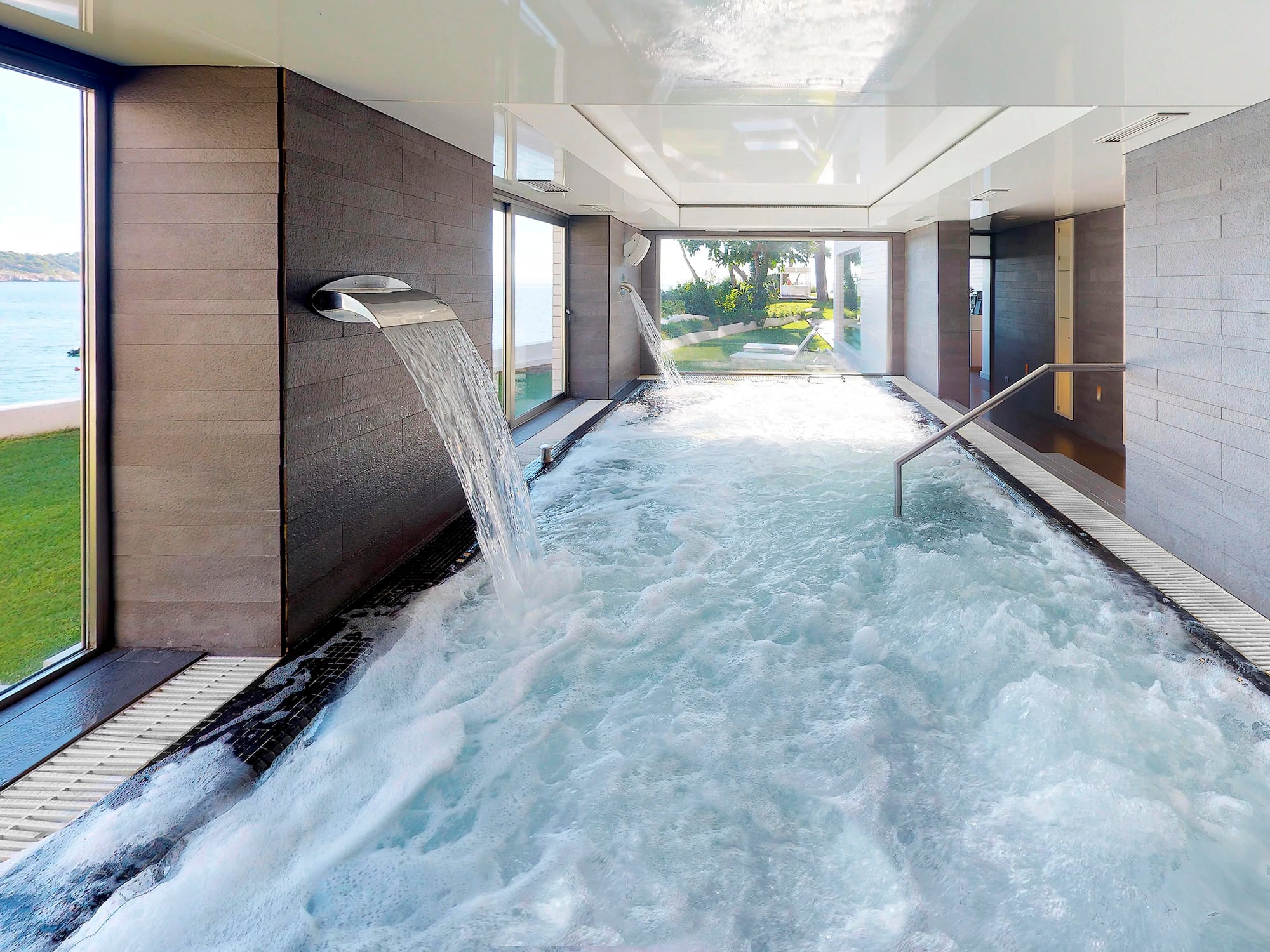 a hot tub with water falling out of it