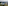 Modern resort, lake, traditional pagoda, contemporary buildings, forested hills, hazy city.