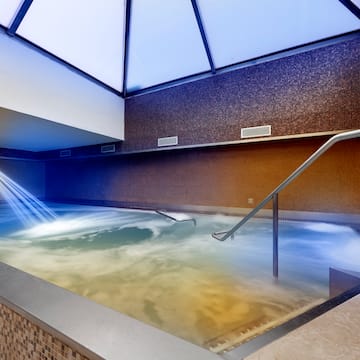 a pool with water and a skylight