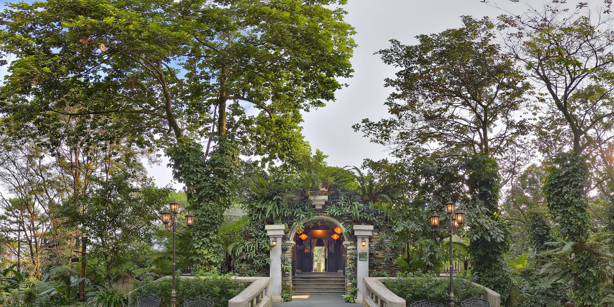a building with stairs and trees