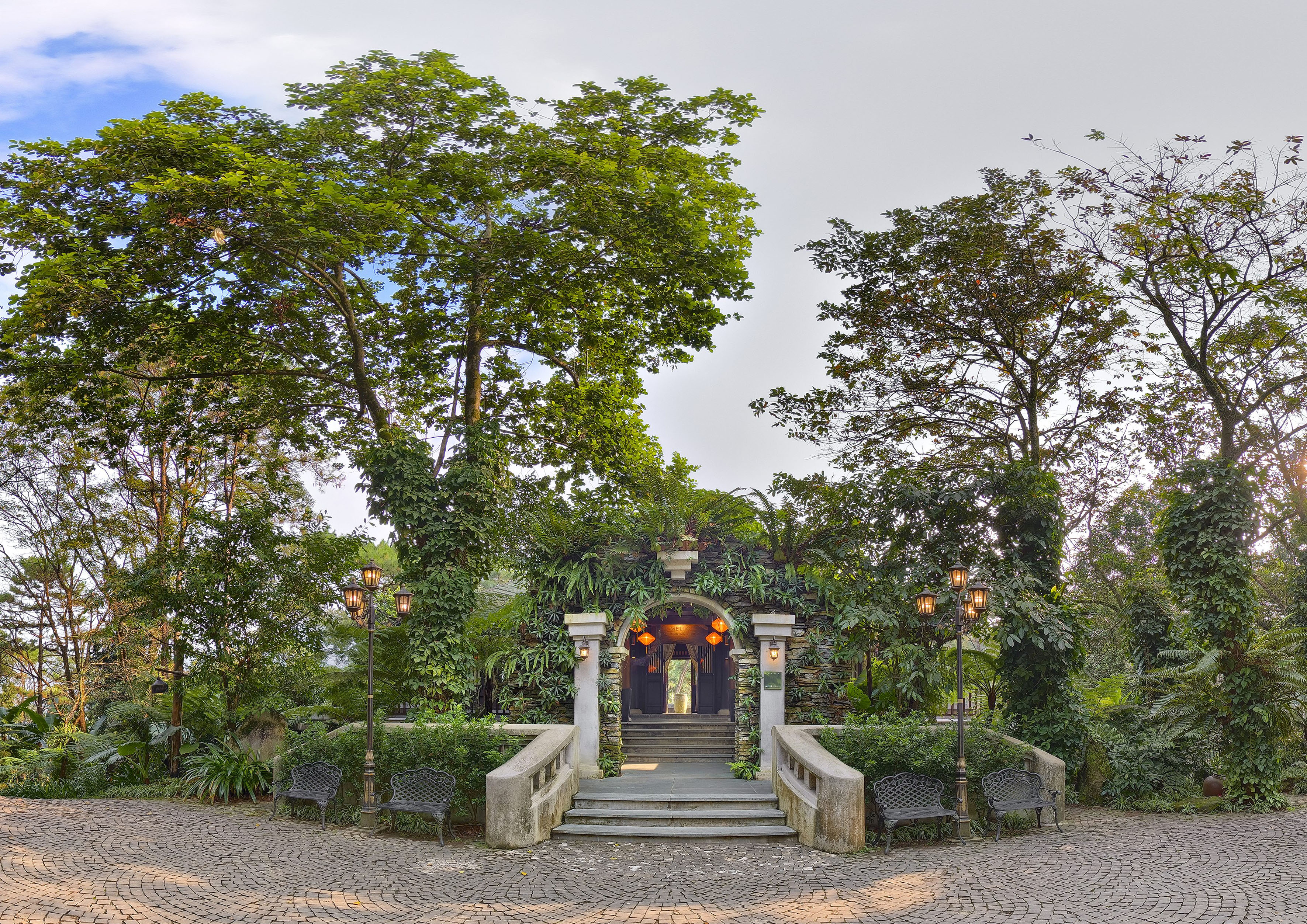 a building with stairs and trees