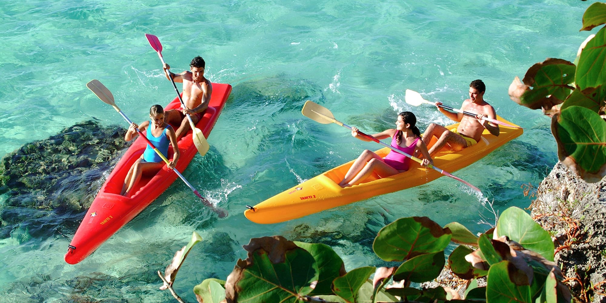 a group of people in kayaks on the water
