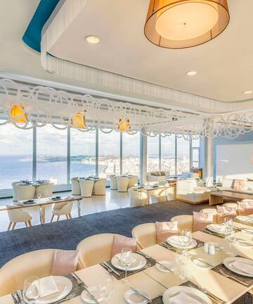 a large room with tables and chairs