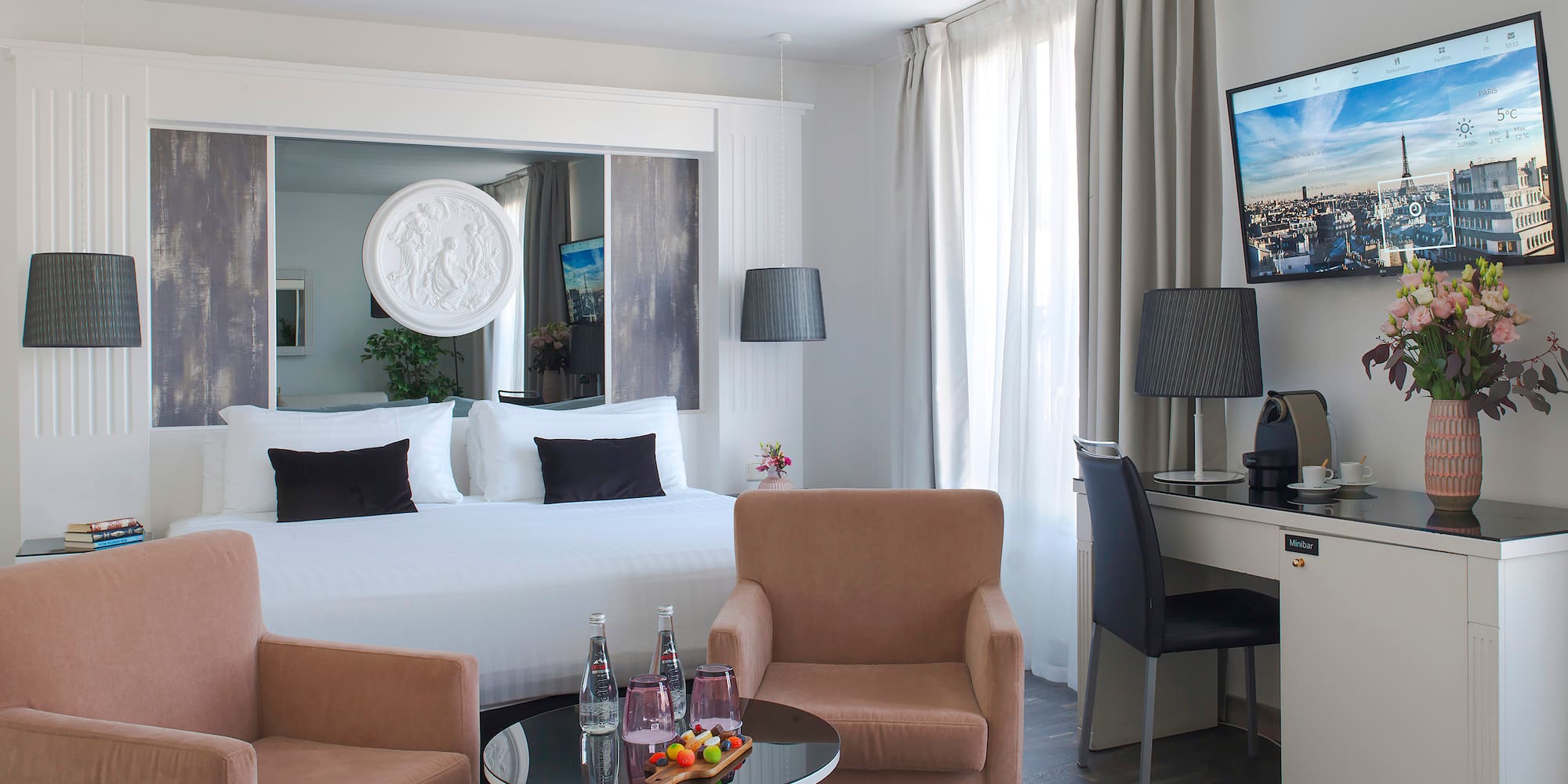 a room with a bed and a television