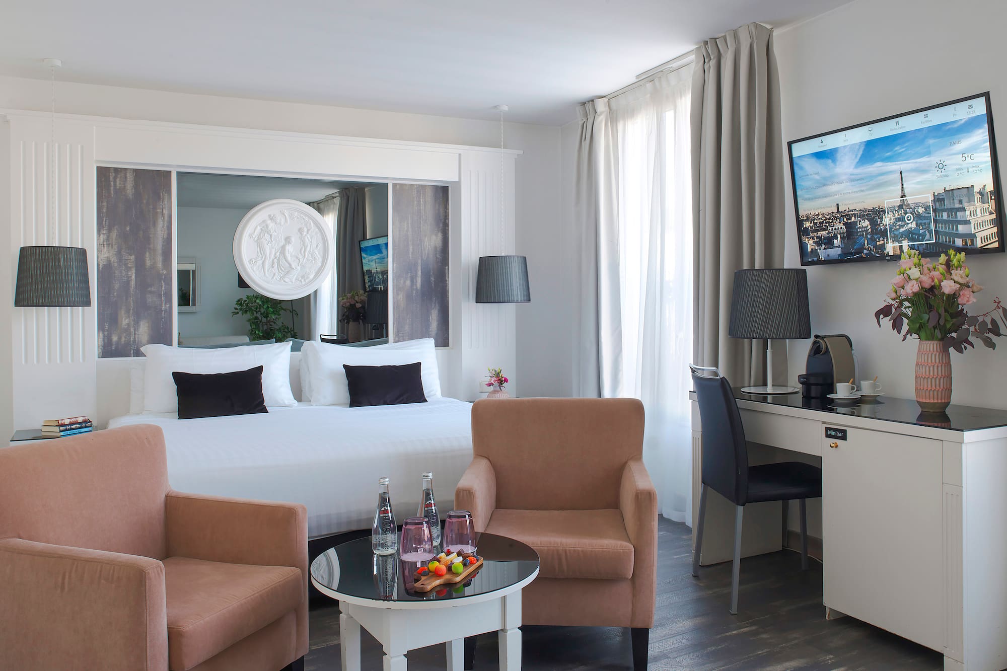 a room with a bed and a television