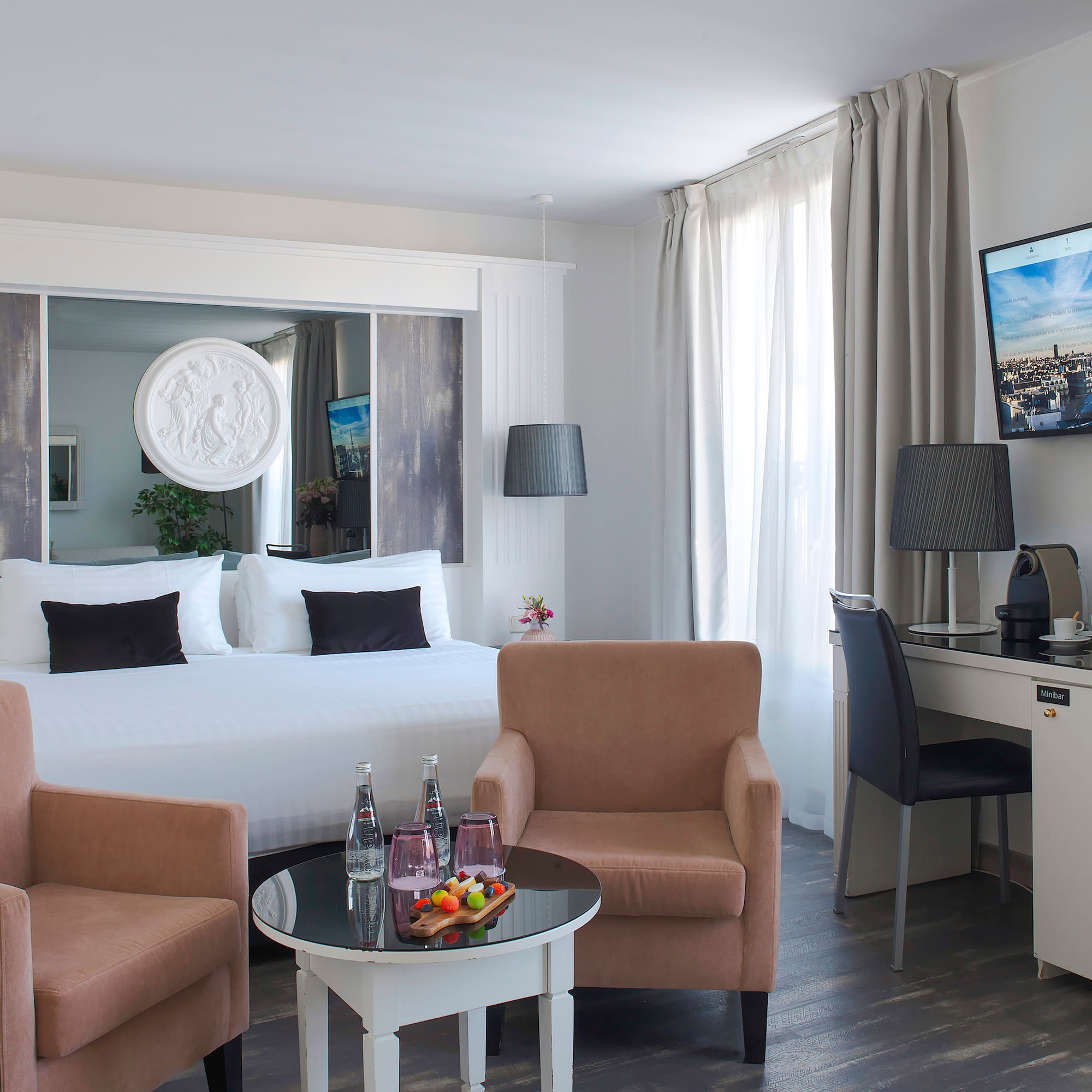 a room with a bed and a television