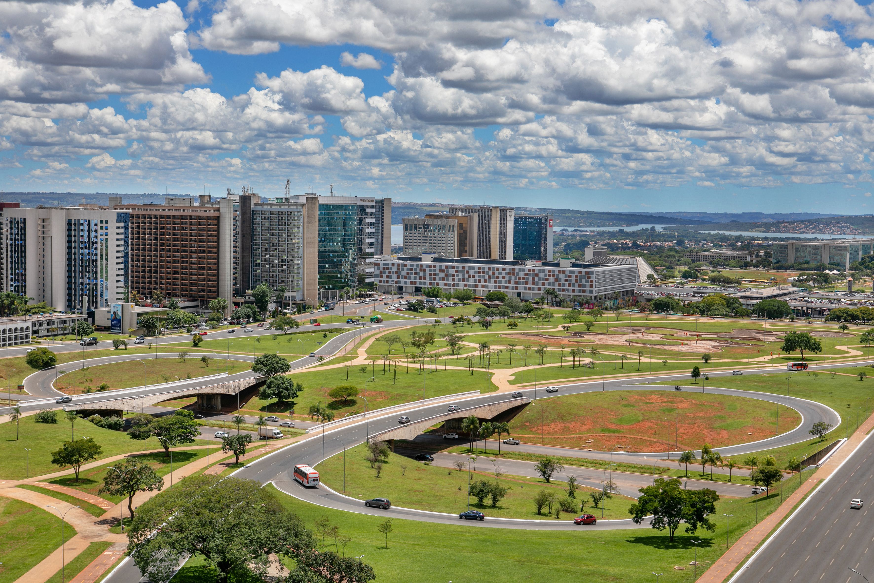 Brasília urban landscape: modern high-rises, complex road network, green areas.